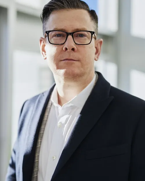 Professional man in a suit posing for a profile portrait